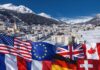Davos y el repliegue de Trump: se evita la ruptura a costa de Groelandia Panorámica invernal de Davos, Suiza, con banderas de potencias occidentales sobrepuestas de forma simbólica durante el Foro Económico Mundial.